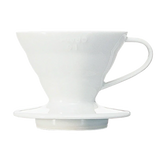 Hario V60 white ceramic coffee dripper, featuring spiral ridges and a conical design for optimal coffee extraction.