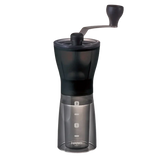 Hario Ceramic Coffee Mill Mini-Slim Plus, compact hand grinder with adjustable ceramic burrs, ideal for travel and home use.