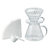 Hario V60 Glass Brewing Set with dripper, glass pot, filter paper, and scoop.